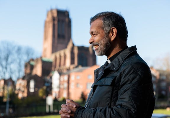Bishop John with Liverpool Cathedral in the background Credit Do L
