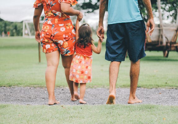 Man and woman holding child