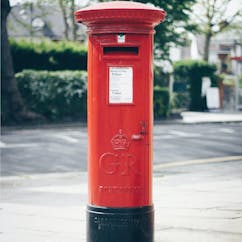 Red post box on street