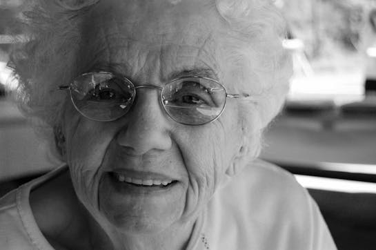 Older woman smiling into camera
